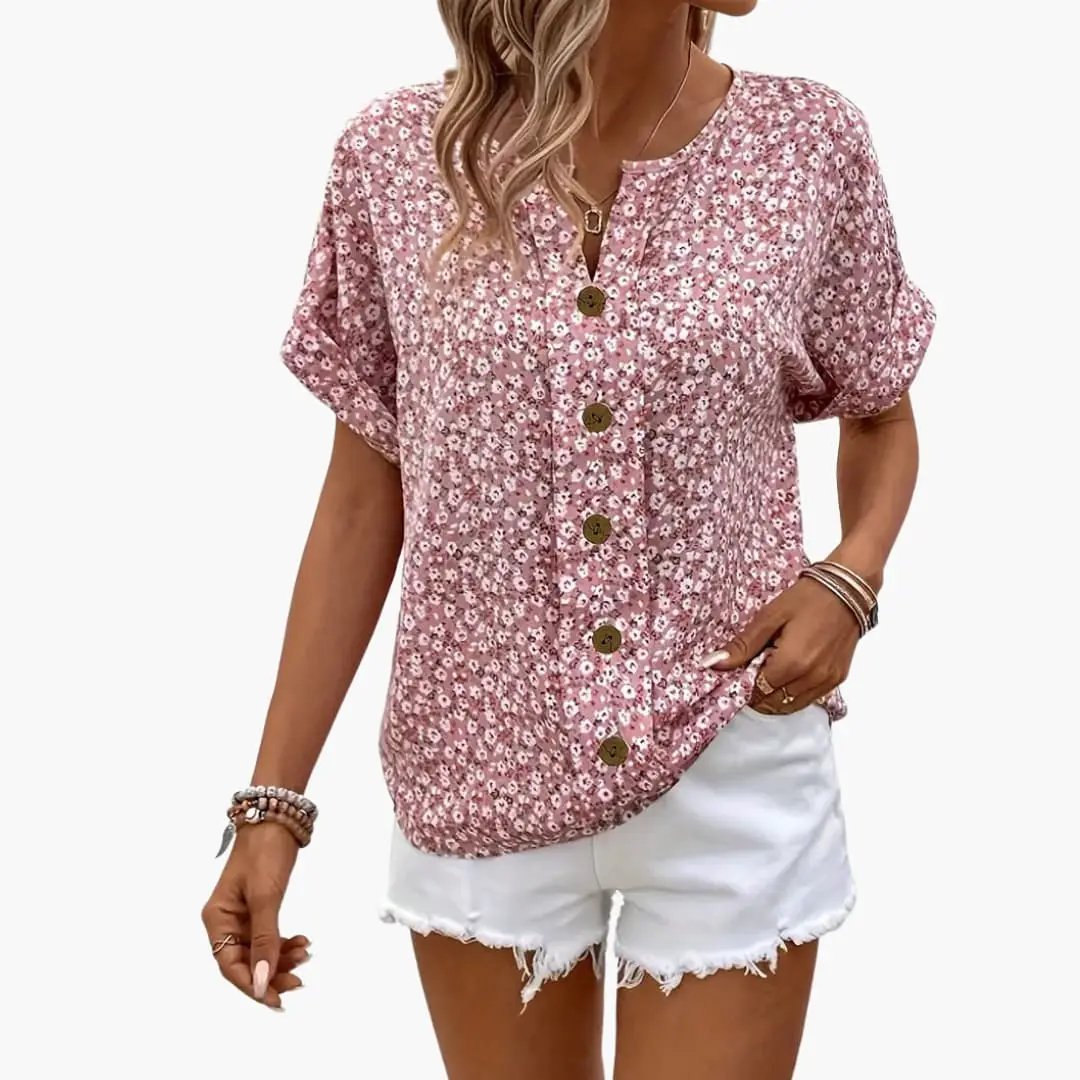 Women’s printed button-down blouse in pink floral with brown buttons, loose-fit short puff sleeves