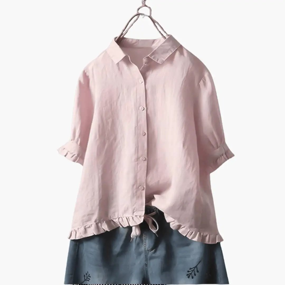 Women's pink woven blouse with collar, button front, rolled sleeves, and ruffled hem