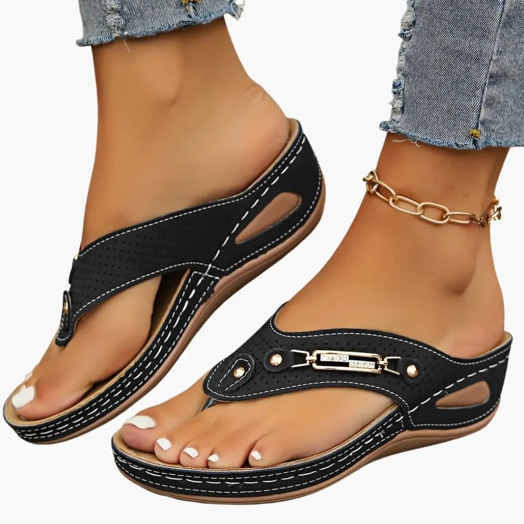 Women's Wilfred Smith sandals with adjustable straps and cushioned sole, black with white stitching