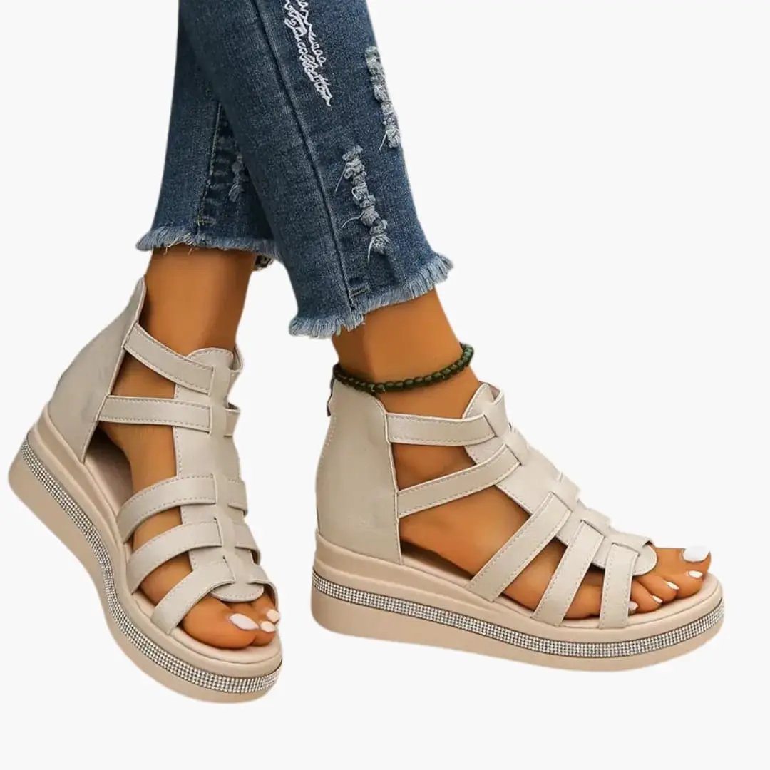 Women's beige wedge sandals with adjustable straps and rhinestone trim