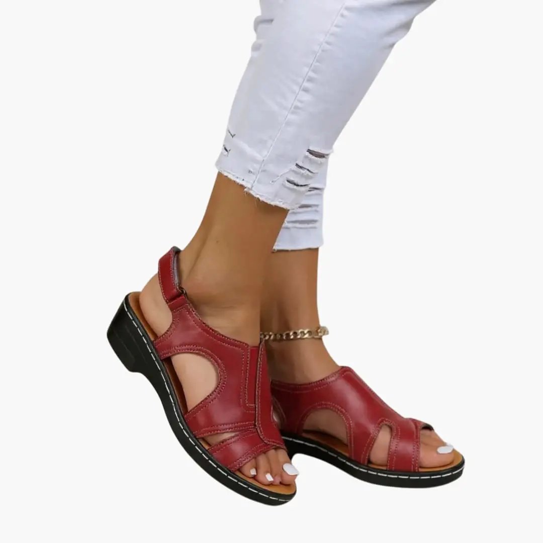 Women's red leather sandals with cushioned insole and adjustable strap fastening