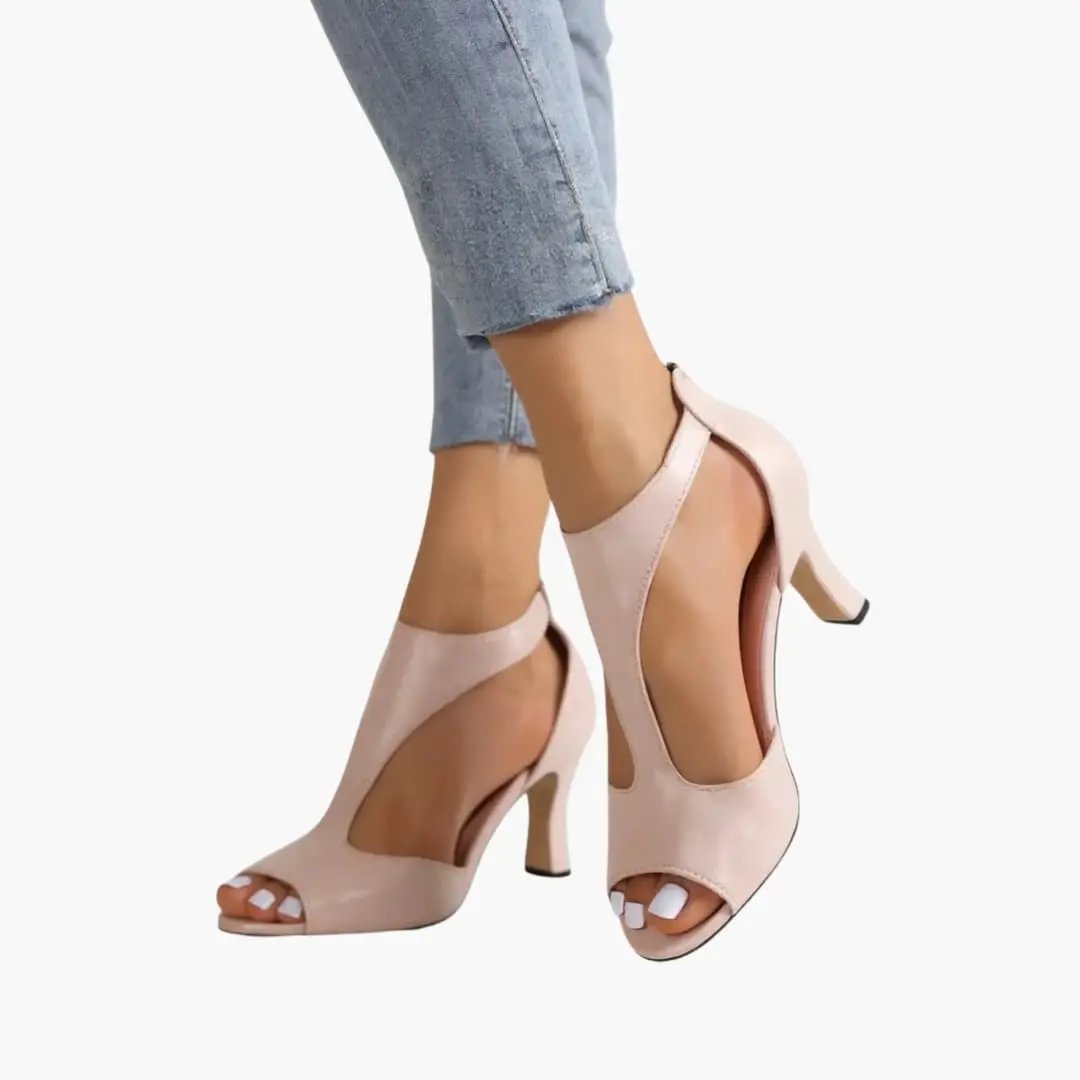 Women's open-toe sandals with cutout upper and block heel in blush-pink faux leather.