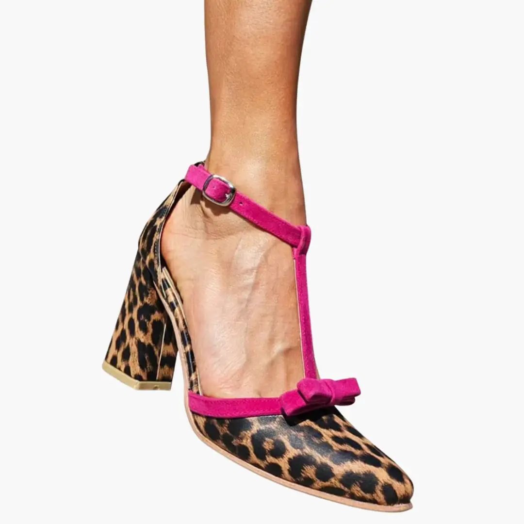 Women's leopard-print sandals with pink ankle strap and bow on toe, mid-height heel