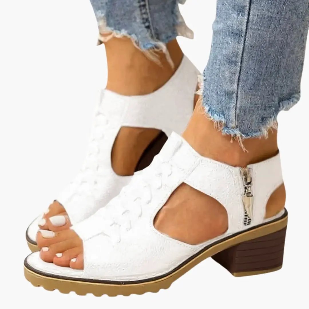 Wilfred Smith women's white sandals with zip closure, open-toe design, cutout sides and mid-block heel.