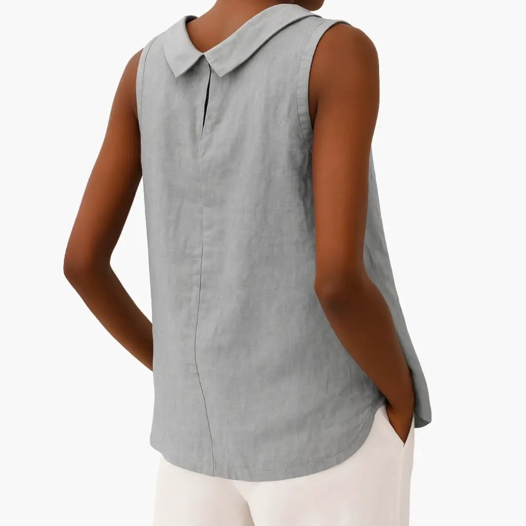 Women’s sleeveless roll-neck top by Wilfred Smith in light gray with a curved hem.