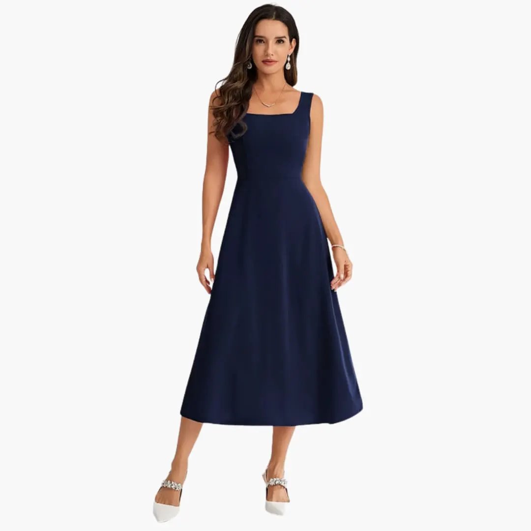 Women's navy sleeveless strap dress by Wilfred Smith with fitted bodice and midi-length straight hem