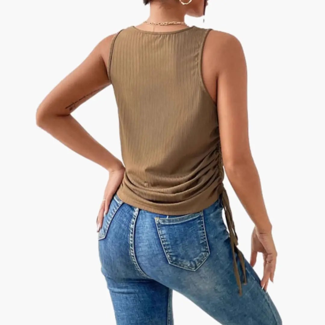 Women's sleeveless tank top in tan with side ruching and elastic hem.