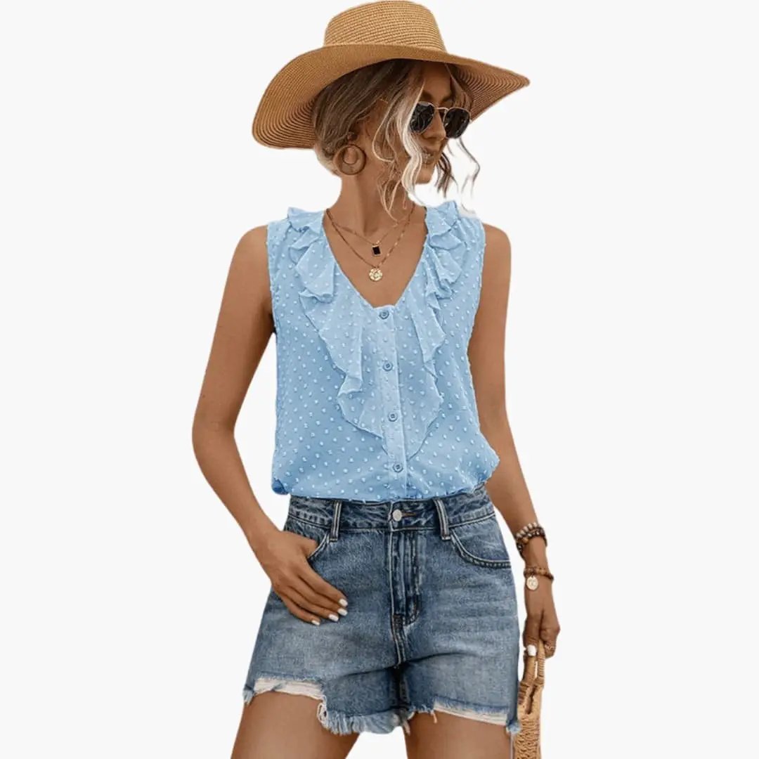 Women's sleeveless V-neck blouse with ruffle trim in light blue polka dots by Wilfred Smith