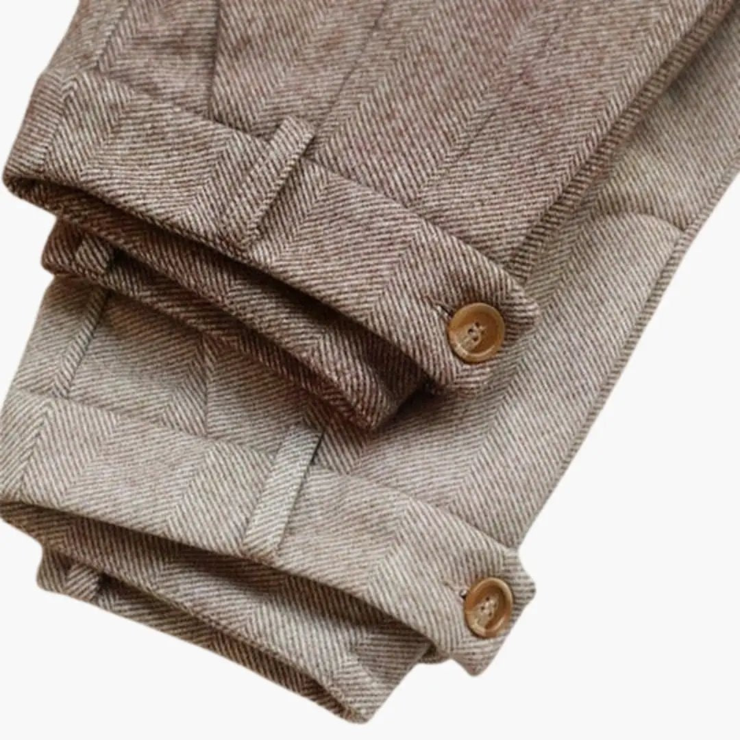 Women's slim-leg trousers in beige tweed with a structured waist and cuffed hems with brown buttons