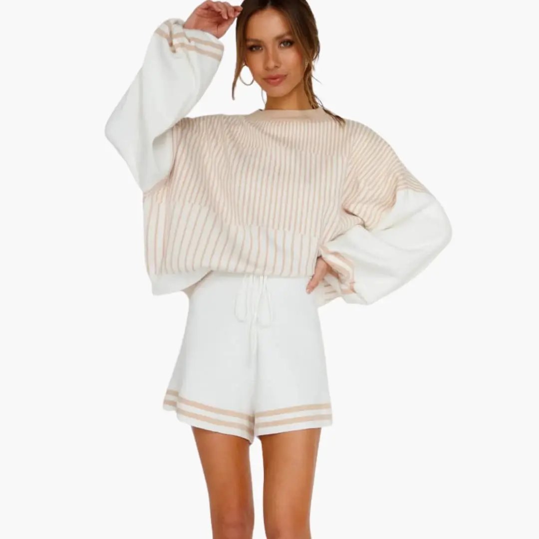 Women's two-piece set: beige and white striped oversized top with long sleeves and white drawstring shorts.