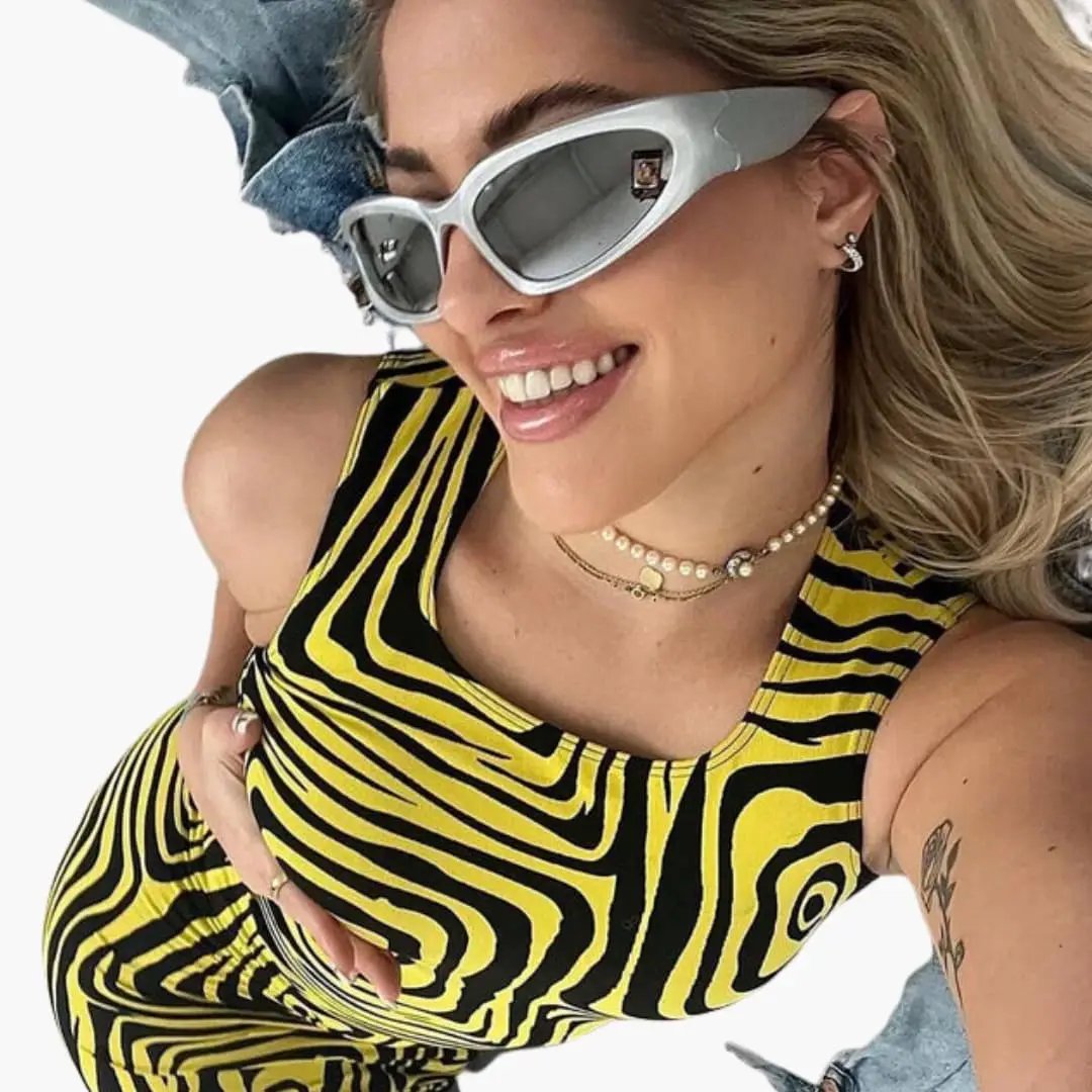 Women's sunglasses with white cat-eye frame and metal detailing by Wilfred Smith