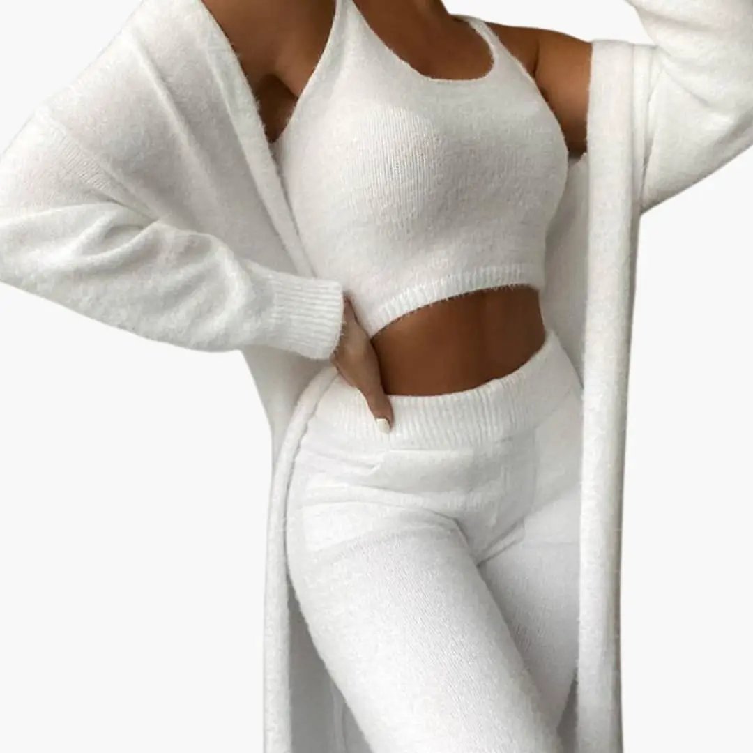 Women's three-piece knit outfit set in white with cardigan, crop top, and high-waisted pants.