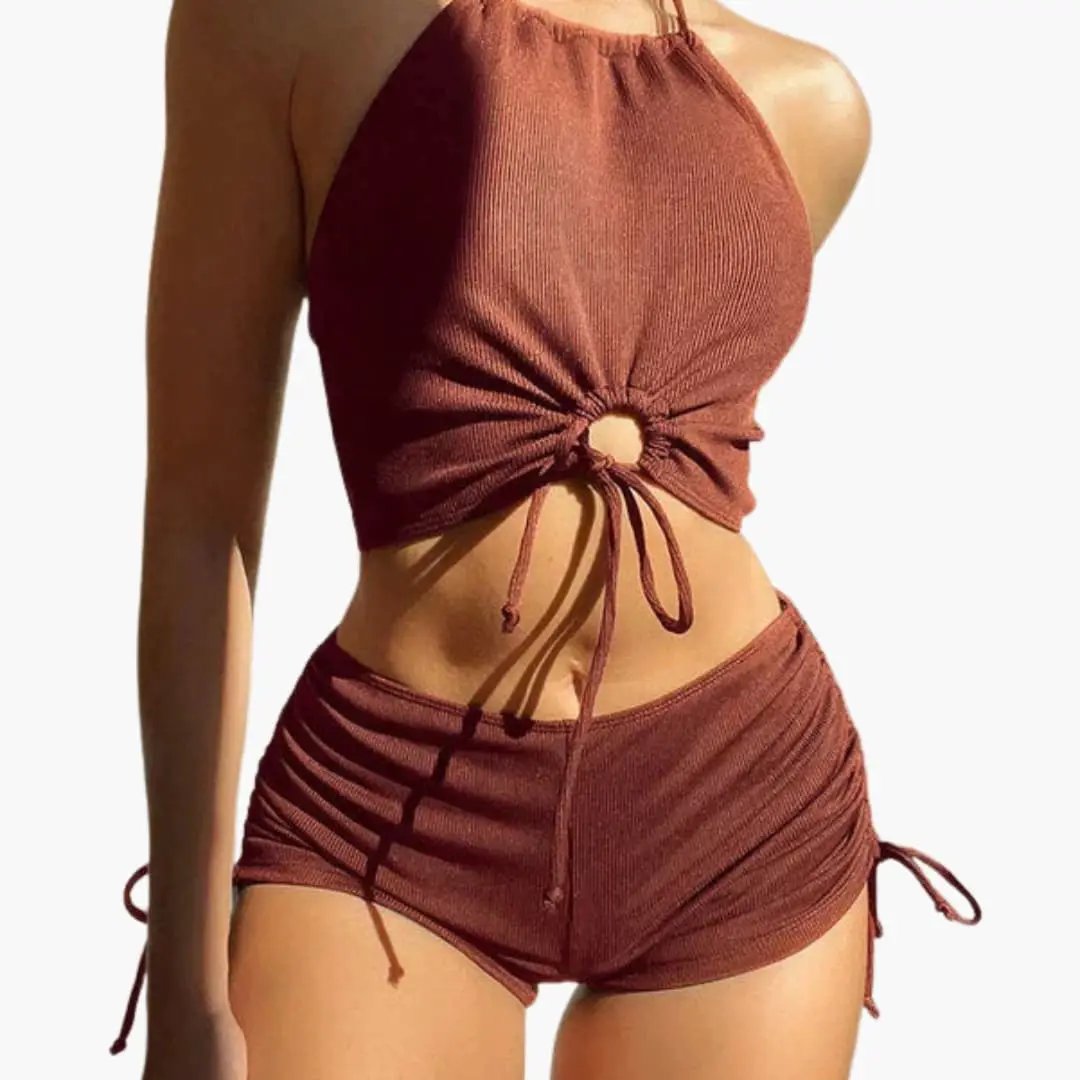 Women's two-piece bikini set in rust-brown with halter top featuring center knot and ruched mid-rise bottoms.