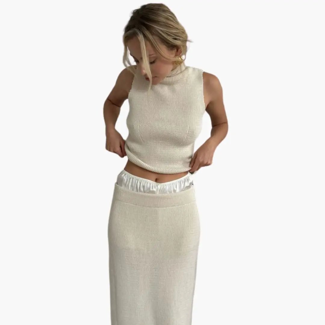 Women's two-piece knit set by Wilfred Smith: cream sleeveless high-collar top with a matching ribbed midi skirt