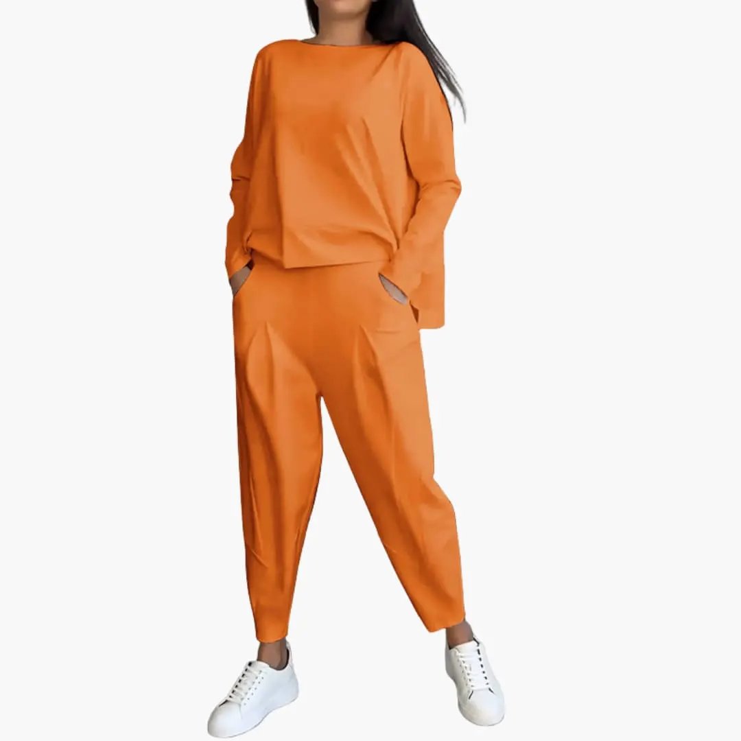 Women’s Two Piece Outfit by Wilfred Smith: orange round-neck top with satin-like trousers and side pockets.