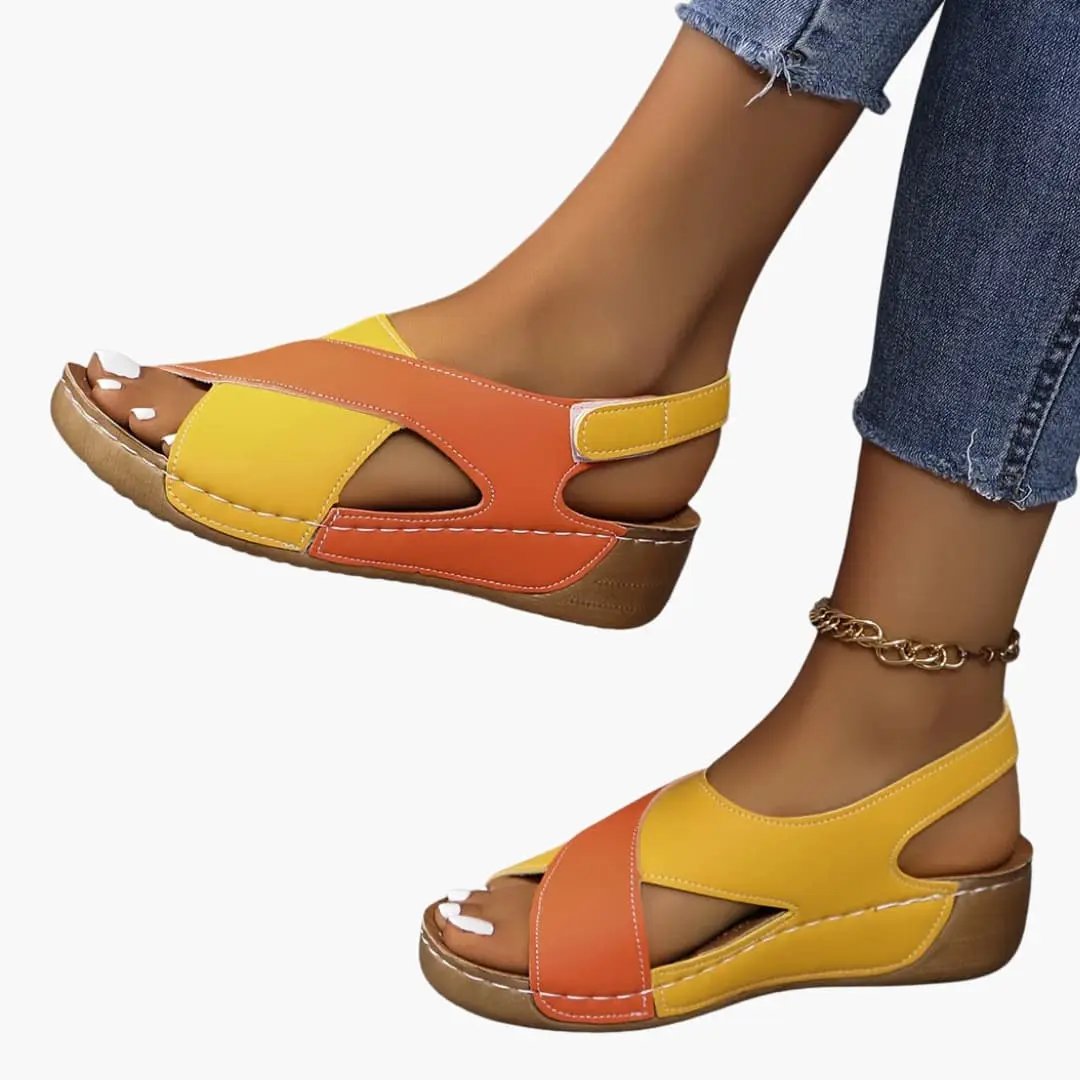 Women's walking sandals in two-tone yellow-orange with adjustable straps, cushioned insole, and wedged sole.