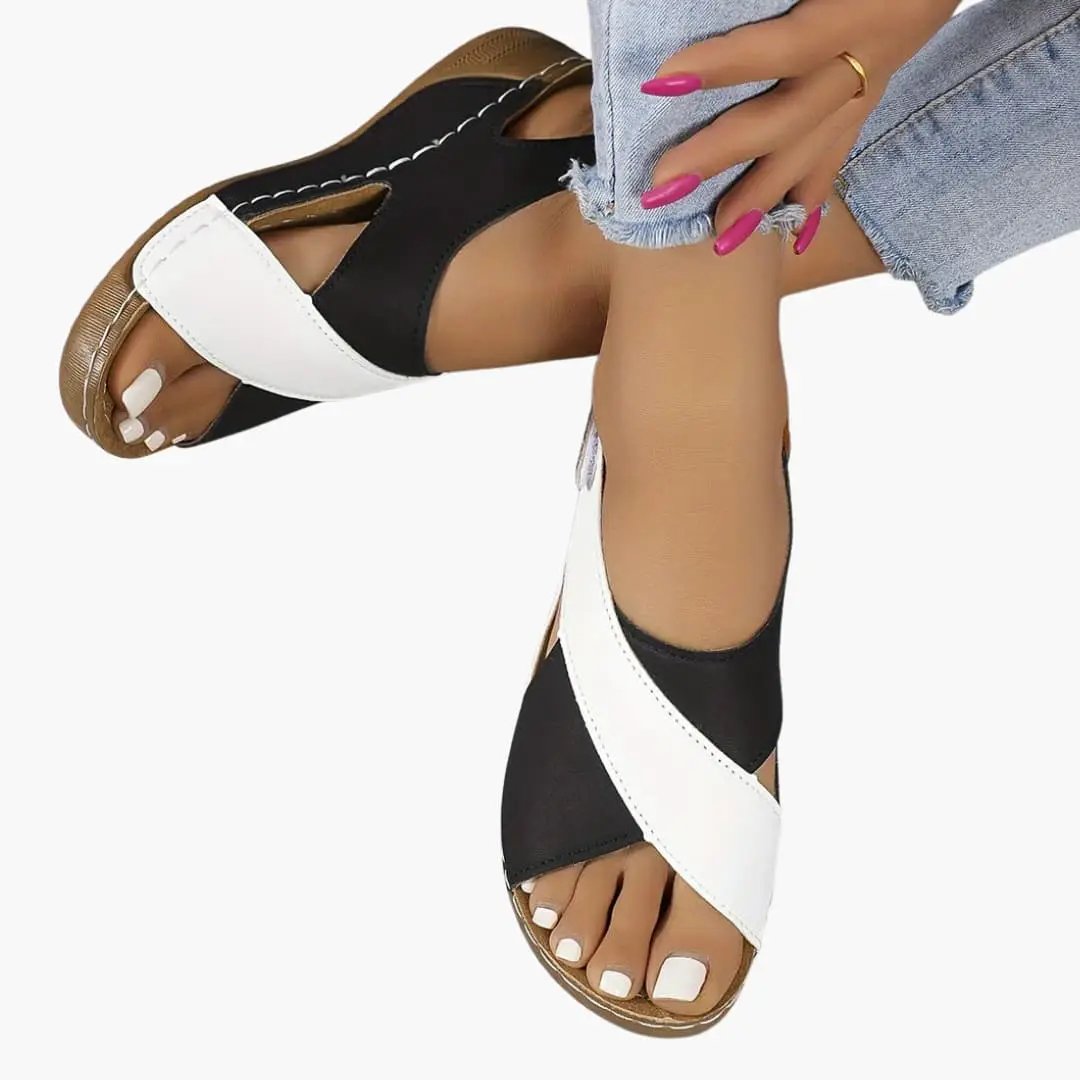 Women's walking sandals with black and white crisscross straps, open-toe, cushioned insole