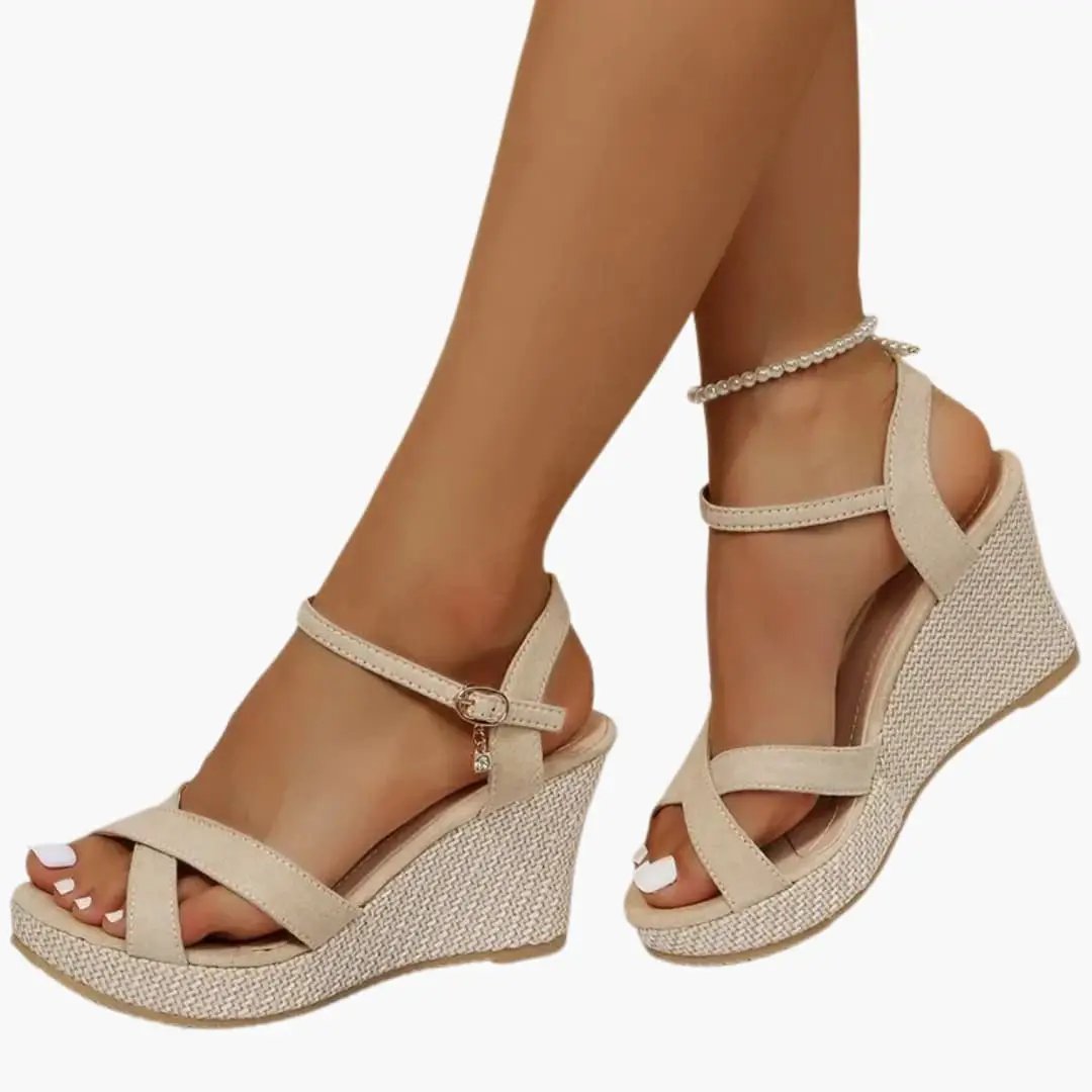 Women's wedge sandals with beige woven espadrille wedge, ankle buckle strap, and cushioned insole.