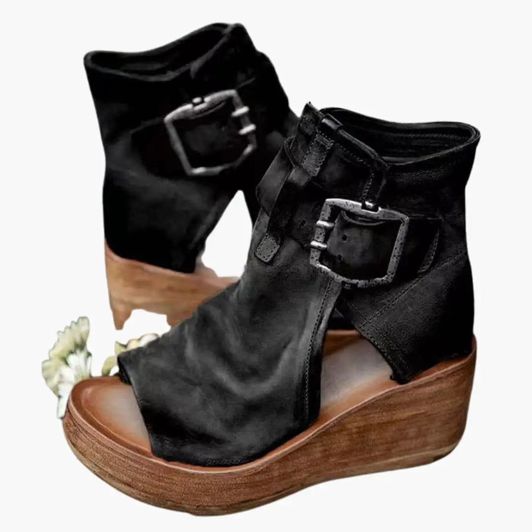 Women's black wedge sandals with buckle straps and contoured wooden wedges, two pairs shown