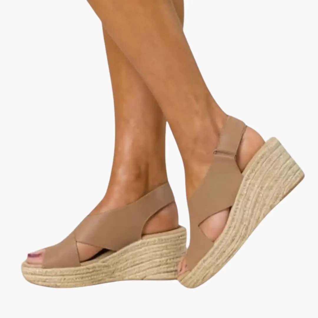 Women's wedge sandals by Wilfred Smith with cushioned insole, ankle strap, tan leather and jute wedge