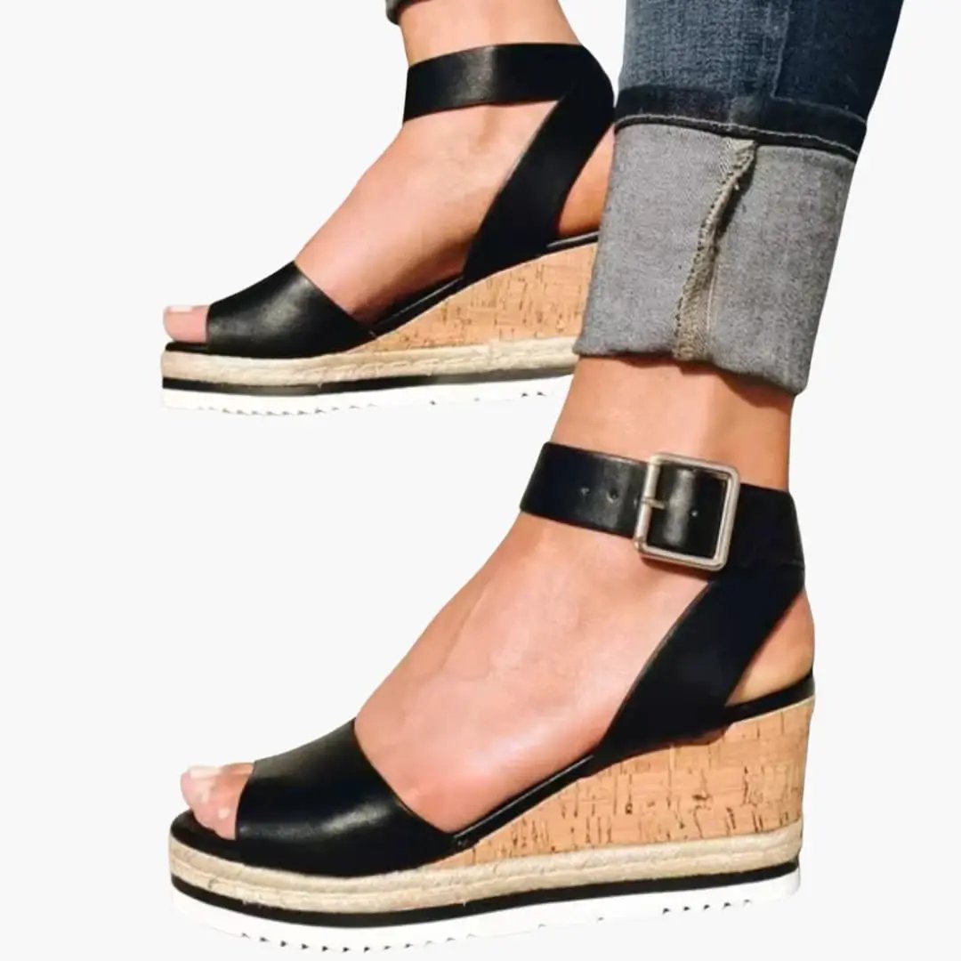 Women's open-toe wedge sandals with cork platform, black straps, cushioned insole and ankle buckle