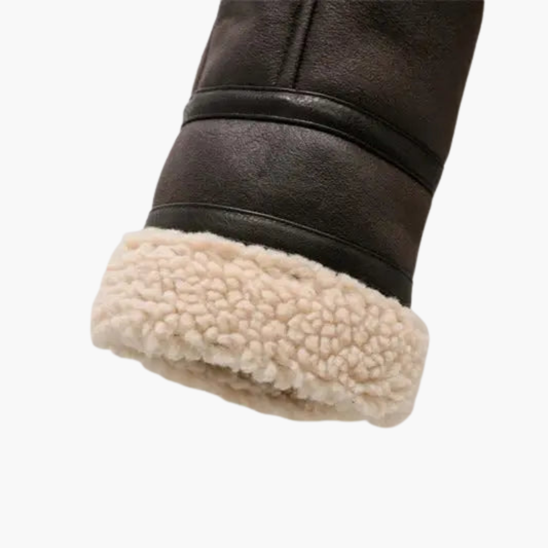 Wilfred Smith women's zip bomber jacket, black leather with plush shearling lining at the cuff.