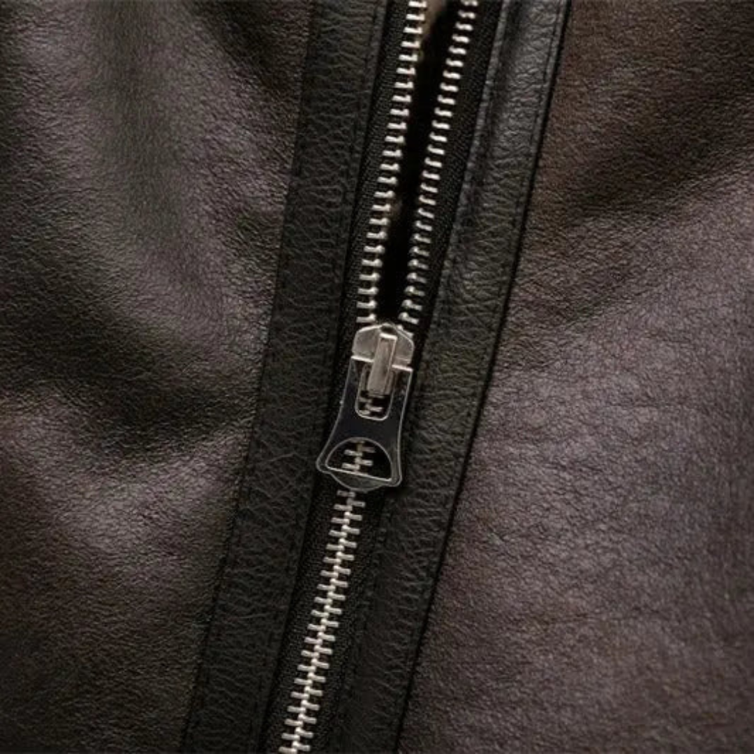 Women's zip bomber jacket in black leather with metal front zipper.
