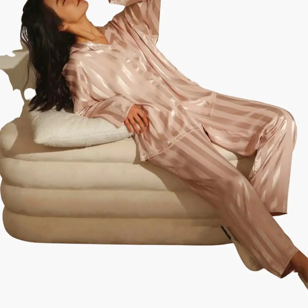 Women's striped blush pink satin pajama set with long-sleeve shirt and pants by Wilfred Smith