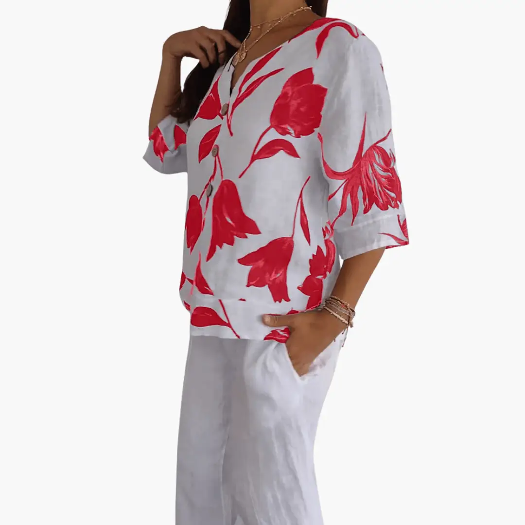 Women's white blouse with red floral print, V-neck top, 3/4 sleeves.