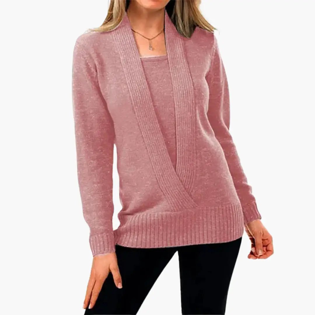 Women's pink knit sweater with deep V-neck wrap and long sleeves, ribbed hem