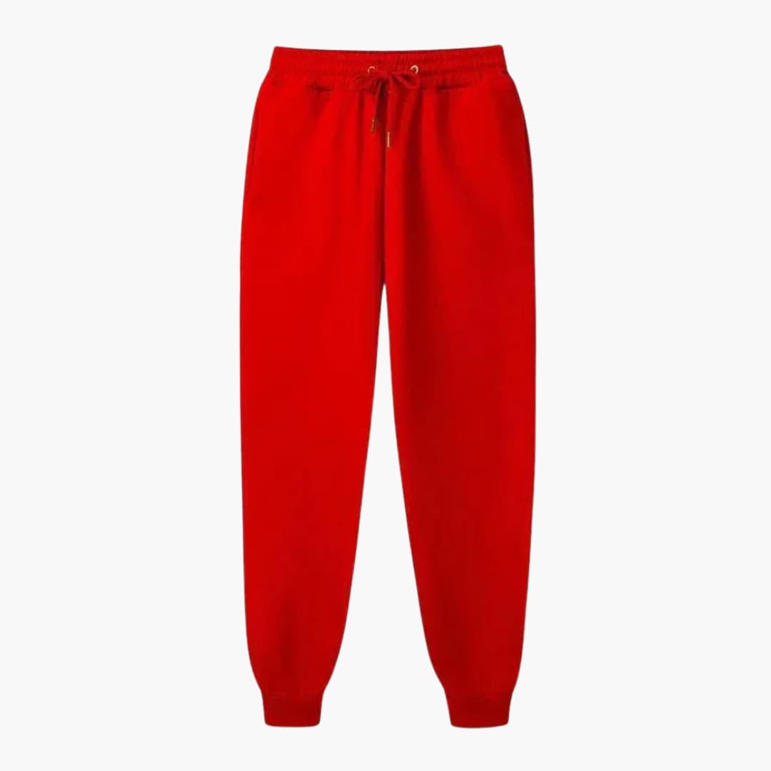 Unisex Wilfred Smith jogging pants in red with drawstring waistband and cuffed hems.