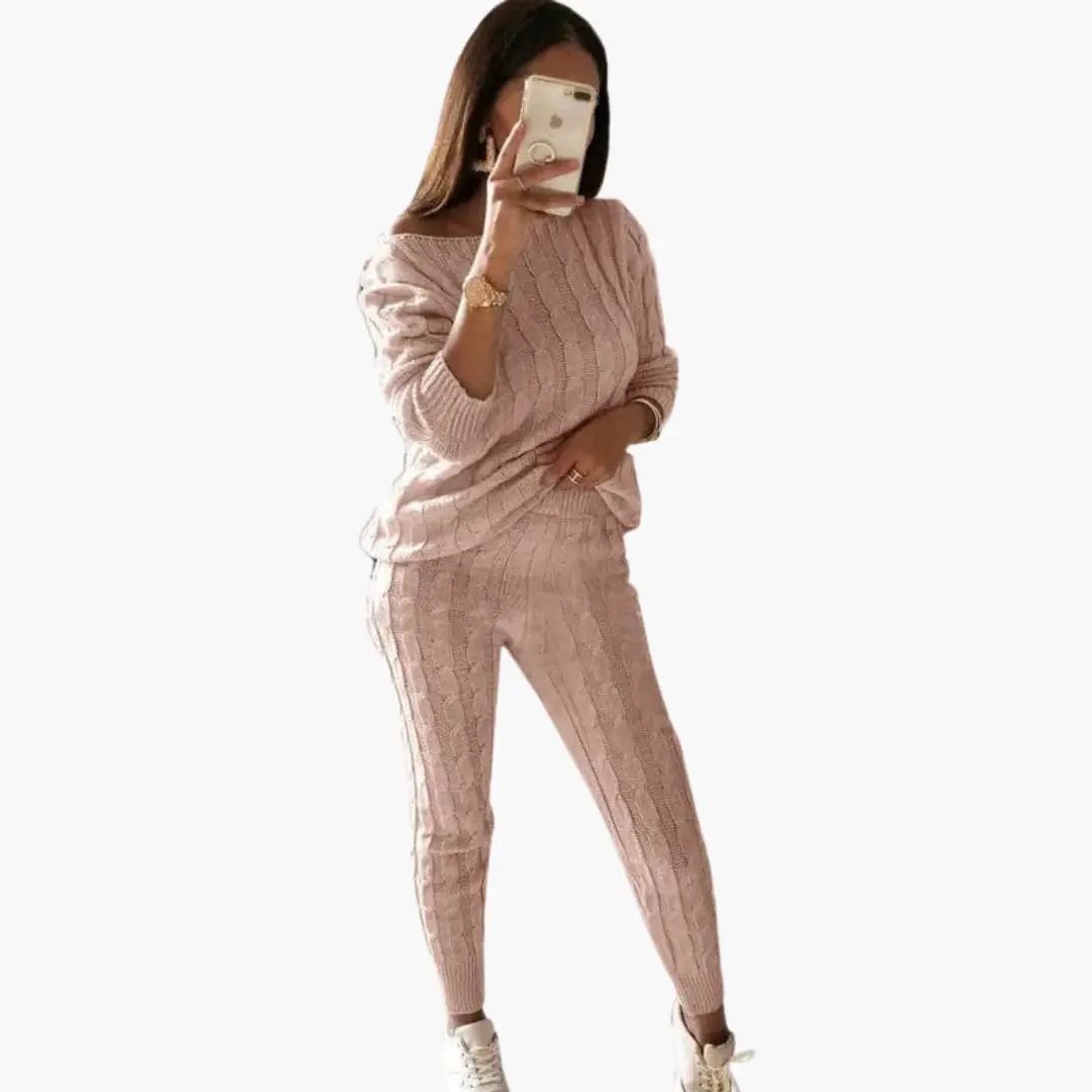 Women's pink cable-knit two-piece set with long sleeves and elastic waistband.