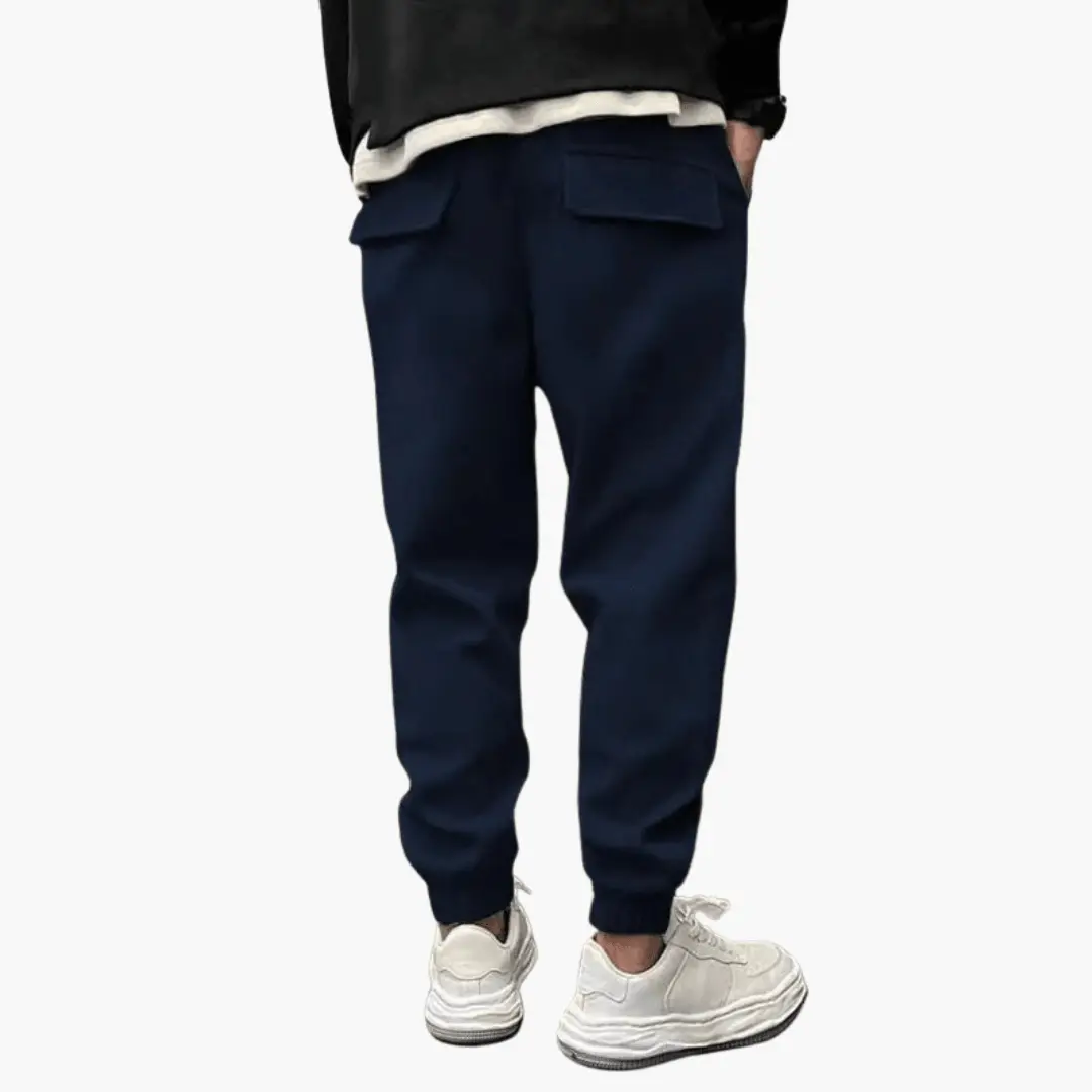 Men’s navy Wilfred Smith cargo trousers with relaxed legs and back flap pockets, elastic cuffs