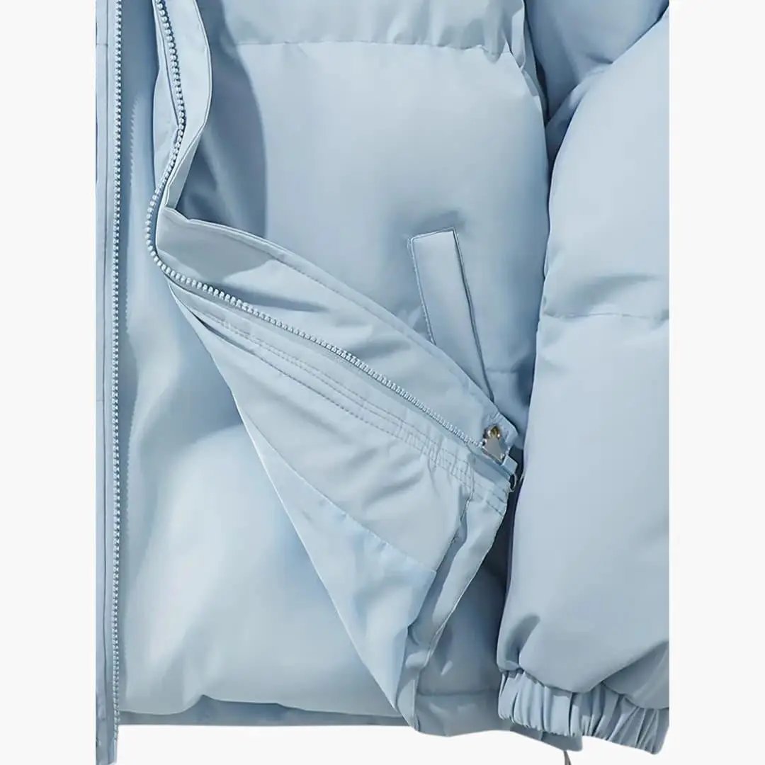 Women's hooded light blue puffer jacket with zipper closure and exterior stitching