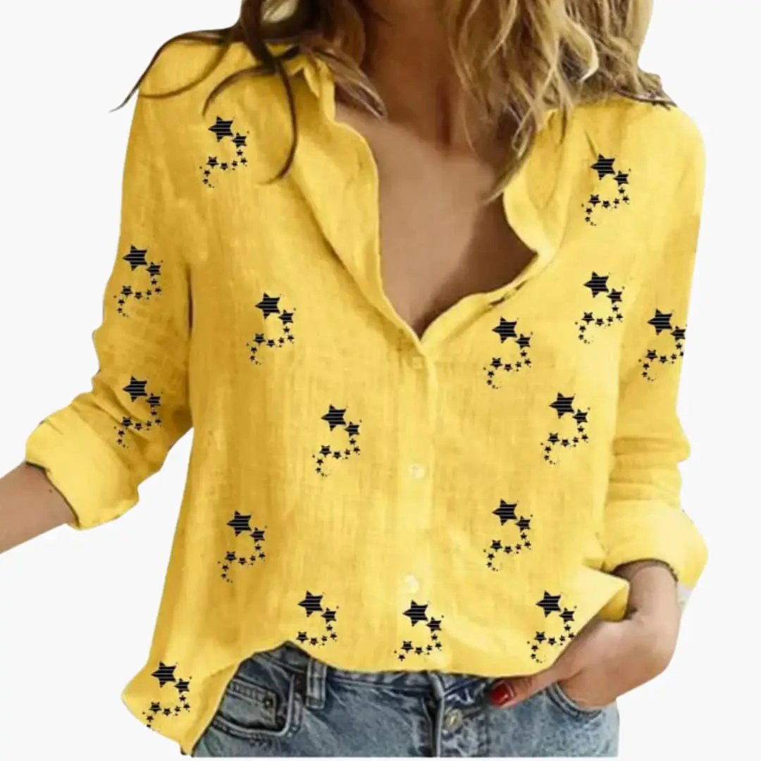 Yellow women's blouse with black star pattern, long sleeves, button-down front