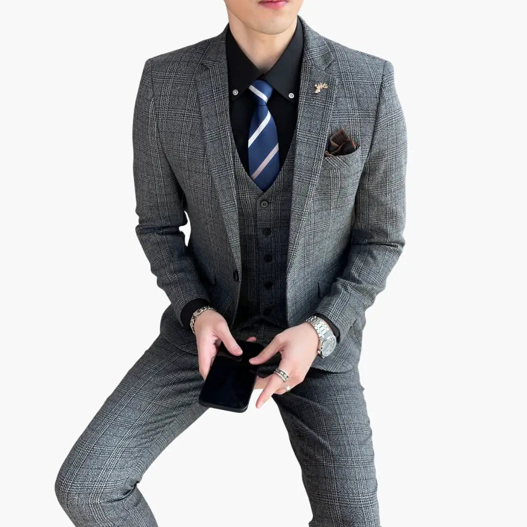 Men's gray check three-piece suit with waistcoat, blazer, and trousers