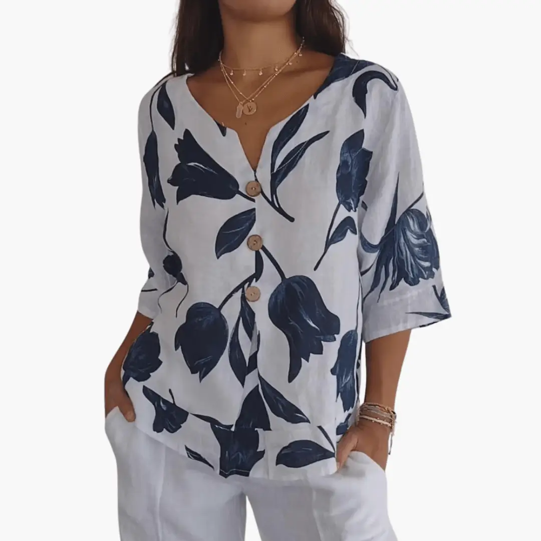Women's floral print blouse in white with navy leaves, V-neck with wooden buttons