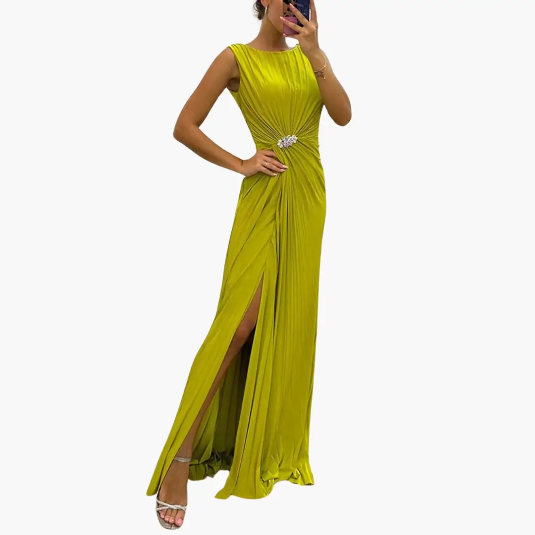 Pleated maxi dress in lime green with front slit and jeweled waist detail.