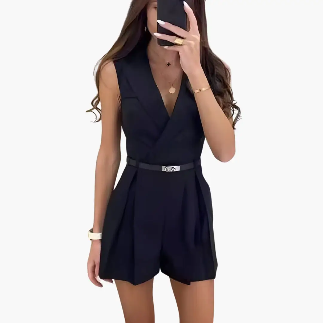 Jumpsuit Rosie style, black sleeveless with V-neck, belted waist, and tailored short bottoms.