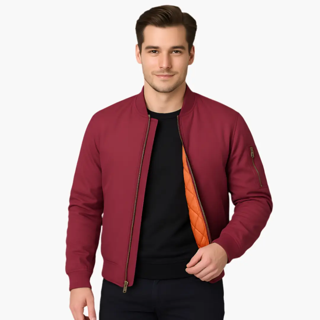 Men's bomber jacket in burgundy with orange quilted lining, front zipper and ribbed cuffs.
