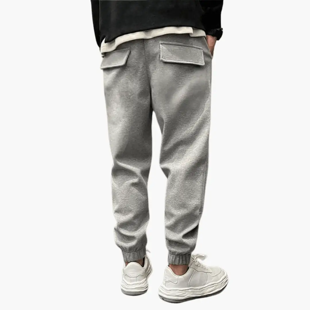 Wilfred Smith Men’s Cargo Trousers with relaxed legs, gray fabric and back flap pockets, cuffed ankles