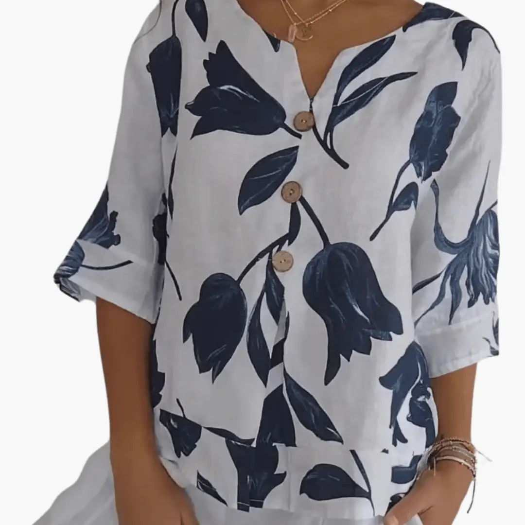 Wilfred Smith women's floral print blouse in white with navy blue flowers, V-neck front with wooden buttons.