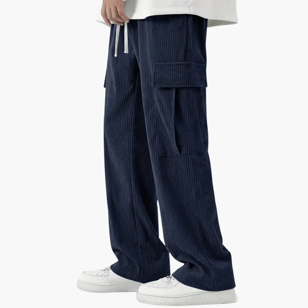 Men's Wilfred Smith corduroy pants with elastic waistband, drawstring, and cargo pockets in navy