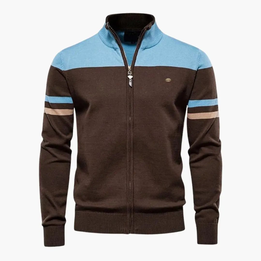 Men's zip-up cardigan by Wilfred Smith with ribbed hem, brown body, blue yoke, and striped sleeves.