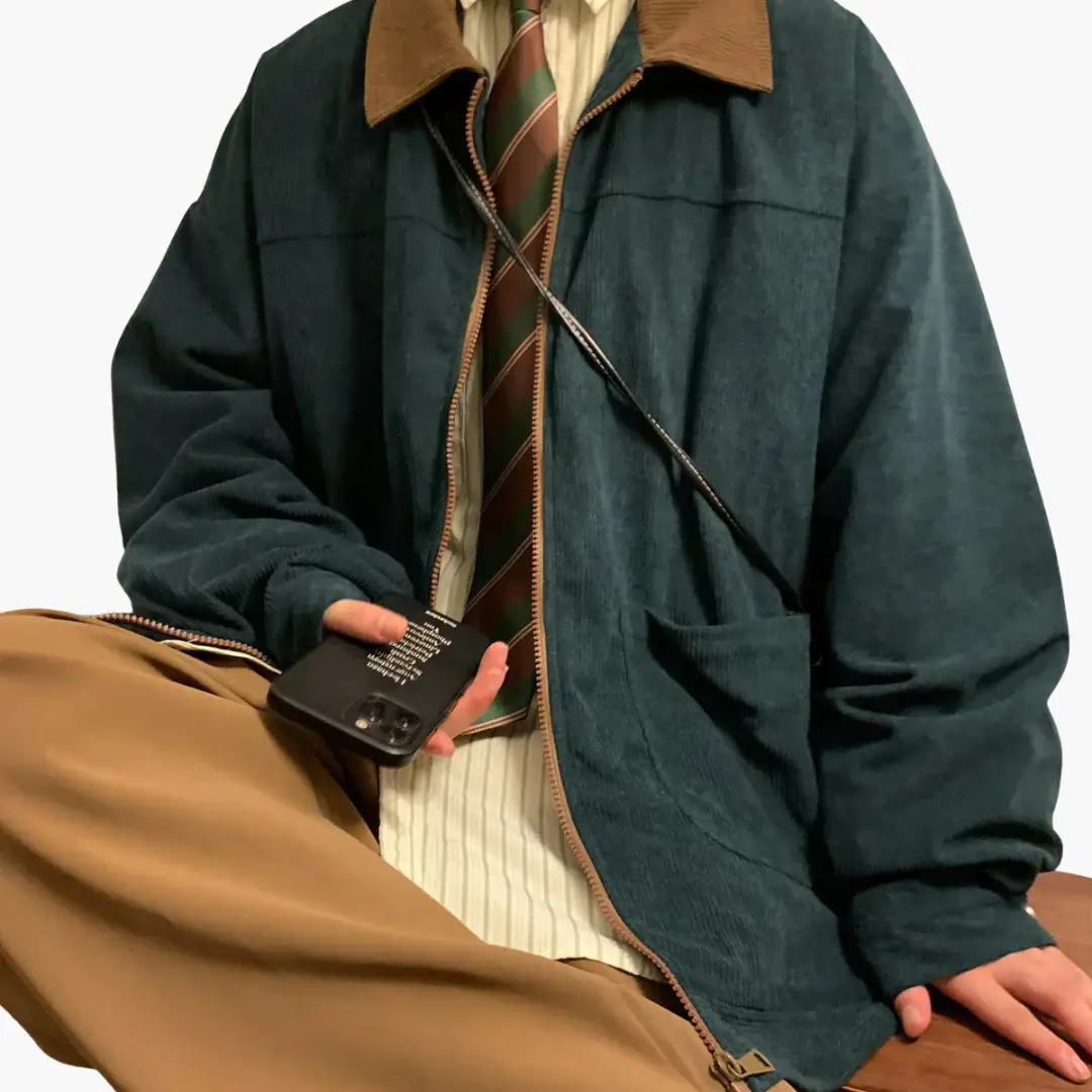 Men's corduroy bomber jacket in dark teal with brown collar, front zipper and pockets