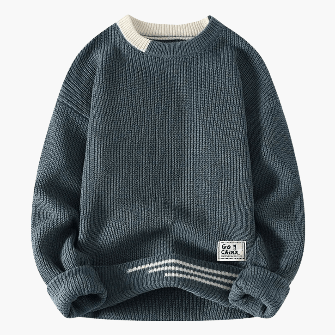 Men's navy knit pullover with round neckline and ribbed hem, white striped hem, label patch