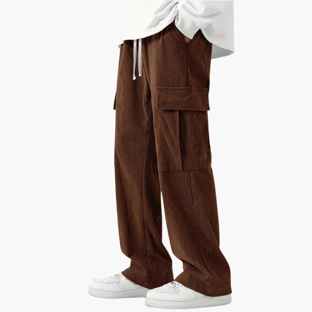 Men's corduroy pants with elastic waistband and side pockets by Wilfred Smith, brown.
