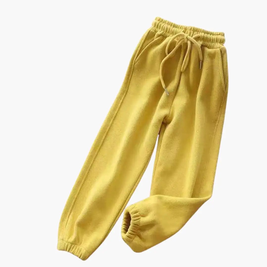 Women's jogging pants with drawstring waistband and cuffed ankles in yellow velour.