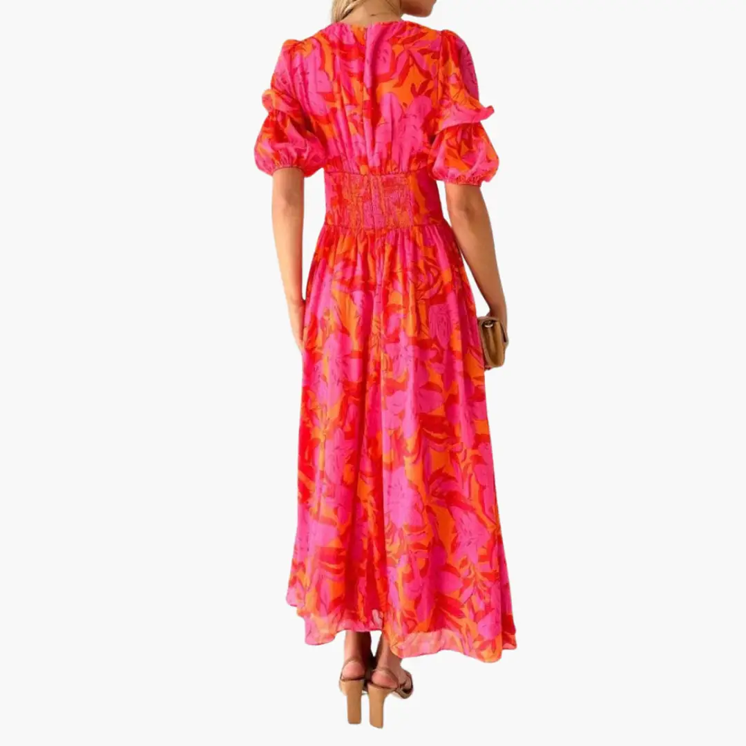 Elegant maxi dress for women by Wilfred Smith in pink and orange floral print with puff sleeves