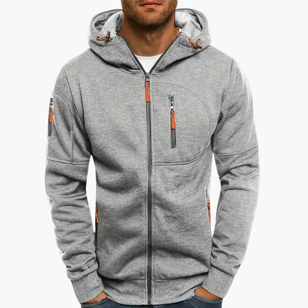 Men’s Hooded Jacket with Zipper and Pockets in grey by Wilfred Smith, a track jacket with orange zipper pulls.